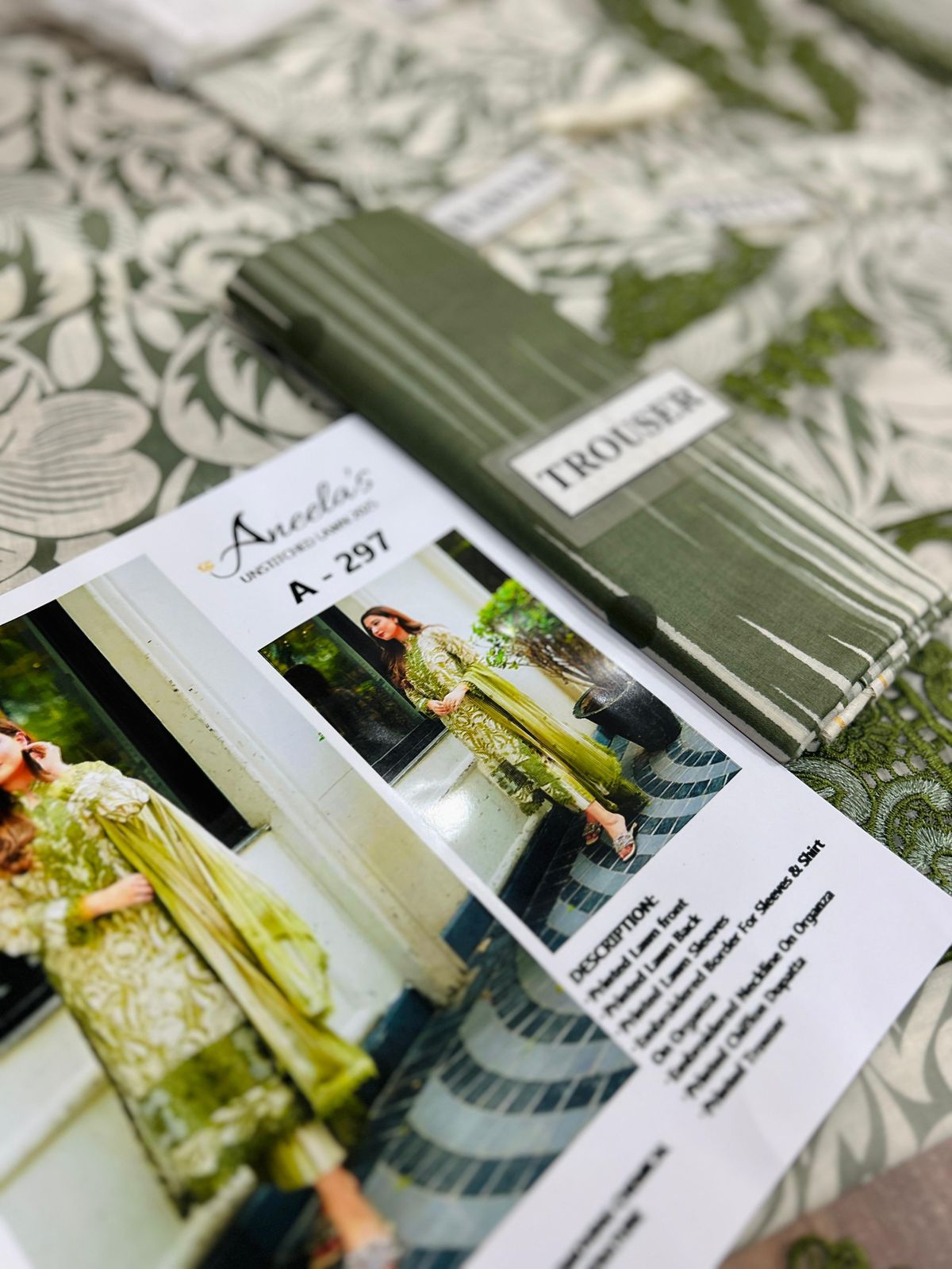 Aneela’s Design A-297 – Unstitched Printed Lawn 3 Piece Suit with Embroidered Neck Patch & Chiffon Dupatta